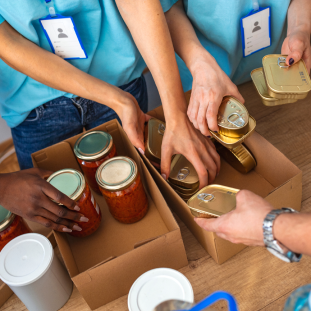 people handing food in boxes