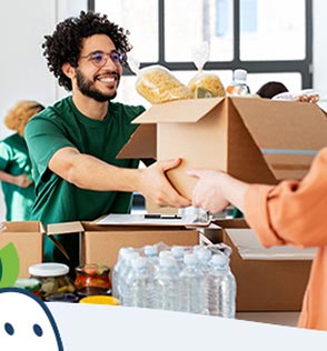 man receiving box of donated food