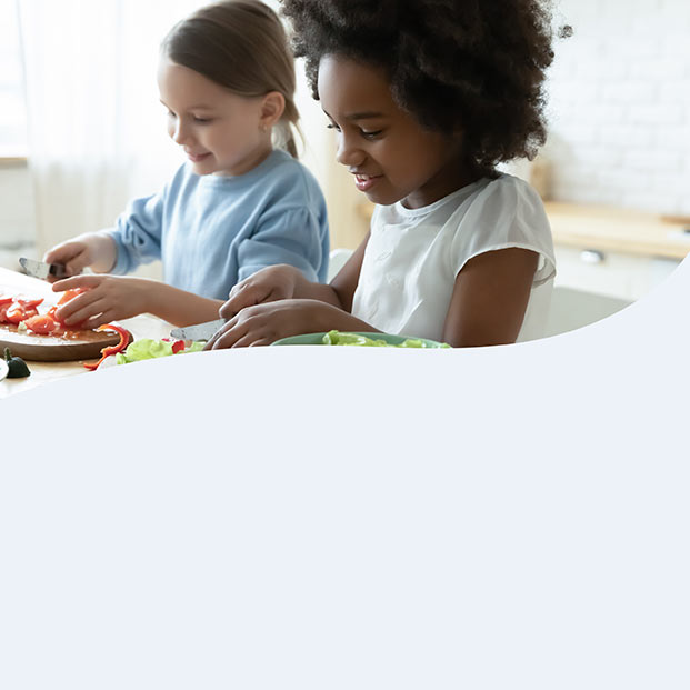 Children making a salad